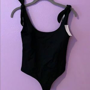 Black low-back body suit with bow tie sides